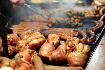 Food booth selling traditional Polish street food at a Christmas Market stall in Krakow, Poland. Traditional Polish street food in Cracow. 