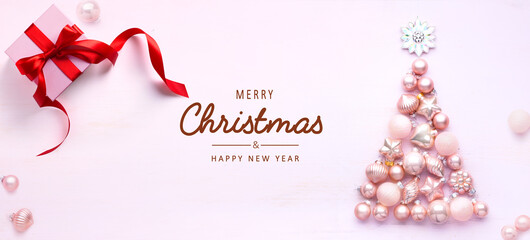 Art Christmas tree decoration and gift box on light background