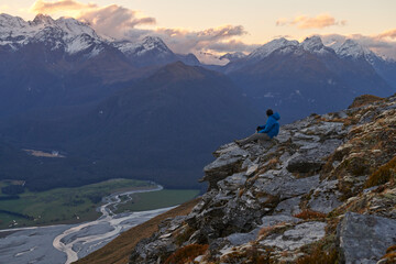 Hiker on top of Mount Alfred Glenorchy, South Island, New Zealand.