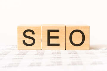 Word seo. Wooden small cubes with letters isolated on white background with copy space available.Business Concept image.