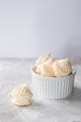Meringues, close up. High key image 