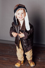 Portrait of a beautiful little boy in a plane pilot costume