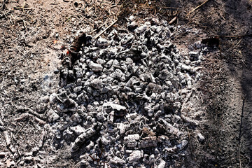 Embers and ashes after a bonfire