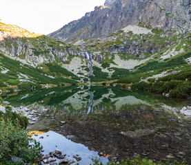 Velicke pleso lake with Velicky vodopad waterfall on Velicka dolina valley in Vysoke Tatry mountains in Slovakia