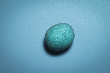 round and smooth stone on a light background