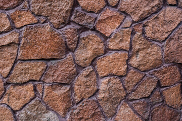 Brown stones are beautifully placed on the house and the fence