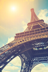 Eiffel Tower against the sky in Paris, France. Famous travel destination. Vintage filter, retro effect