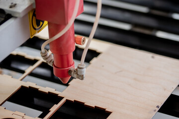 Laser CNC cutting wood. Modern machine industrial technology