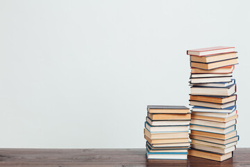 stacks of books for education knowledge in the school library on a white background place for inscription