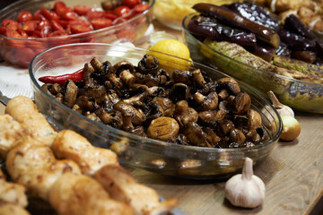 Fried vegetables in dishes on the table, street food