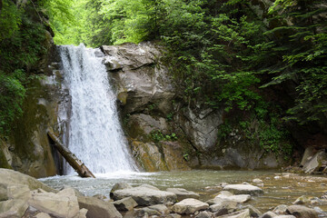 The landscape of Pruncea waterfall and the Casoca river in the Buzau mountains, Romania. A beautiful cascade in the forest © Vali