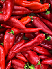 background many red hot peppers top view