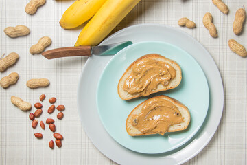 Two slice of peanut butter sandwich on a plate