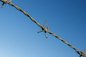 barbed wire on sky background