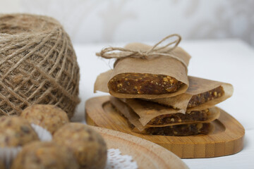 Dried fruit and oatmeal sweets. Homemade Nut & Dried Fruit Energy Bars. Wrapped in paper and tied with twine.