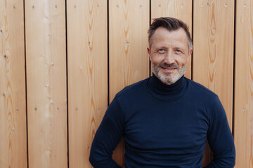 Man looking intently at the camera with a smile