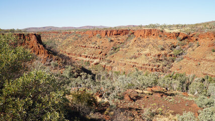 Arid dry red rock landscapes at Dales Gorge within Karijini National Park in the Hamersley Range of Western Australia.