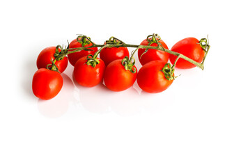 Bunch of fresh red tomatoes with green leaves Isolated on white background. Organic bio vegetables.