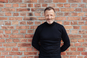 Friendly smiling man in turtleneck sweater