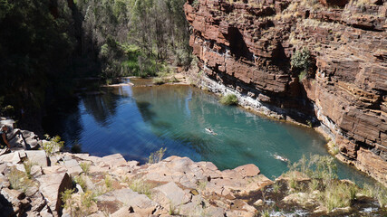 Arid dry red rock landscapes at Dales Gorge within Karijini National Park in the Hamersley Range of Western Australia.