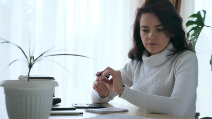 Young Woman Works with Bills Taxes Planning Family Budget. Worried Mother Housewife at Office Table. 2x Slow motion 60 fps 4K