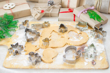 Christmas food. Christmas cookies ginger in the form of Christmas trees. Homemade food. Dough and molds. Gifts and thuja
