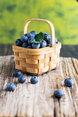 blueberries in  basket on  wooden table