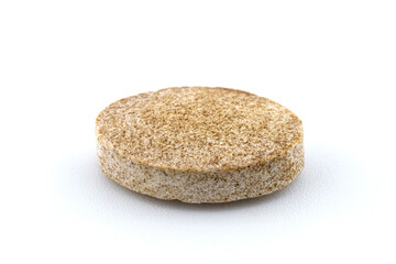 A macro background made of a single brown candy with.
