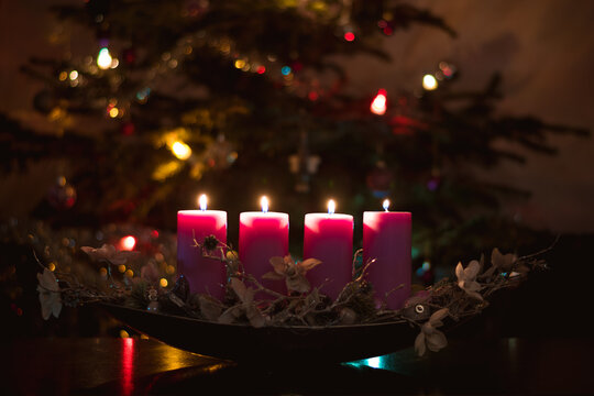 4th advent advent candle burning  in pink color