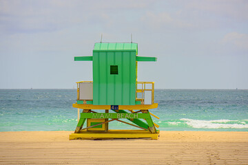 Miami South Beach lifeguard tower and coastline with cloud and blue sky. Sunny day in Miami beach.