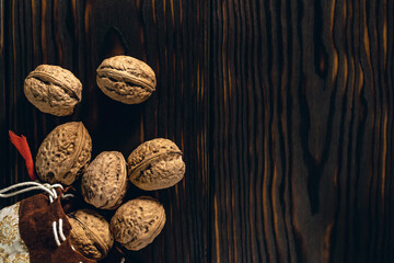 Walnuts on the Dark Brown Wooden Background