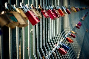 colorful padlocks on the bridge of lovers