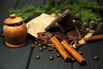 Black chocolate with cinnamon. Fragrant black coffee. Christmas evening.