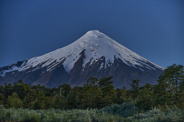 Snow capped Osorno Volcano at night under the star sky, Patagonia, Chile, South America