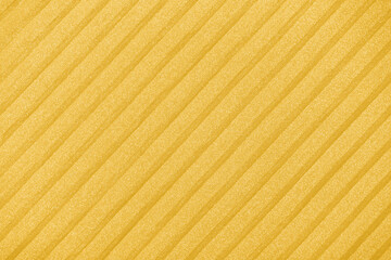Plisse background. geometric cloth lines. Fabric, textile close up, toned in Fortuna Gold, colour 2021