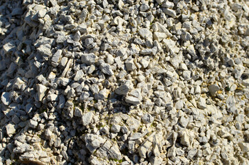 Natural stone mineral. Extraction of minerals used in construction and landscape design. Limestone background, chalk texture. Rock formation mined in an open pit