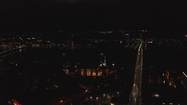 Flying over Riga at night during Staro Riga event. Beautiful illumination of Riga, Latvia.