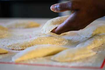 a black hand makes pastry at home