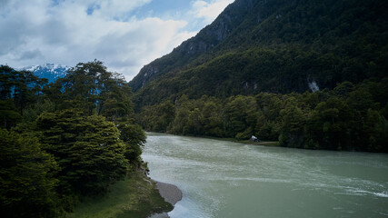 aerial of Cochrane with white water rapids and turquoise river along the Carretera Austral, Patagonia, Chile, South America