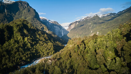 Aerial of Ventisquero Colgante, a hanging Glacier with waterfall and lake in queulat national park...