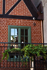 Old brick house with green window