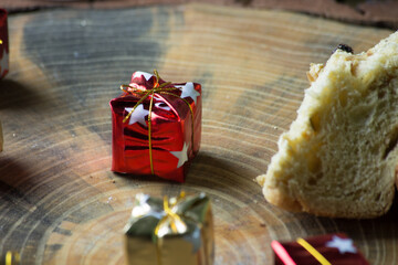 Christmas panettone on rustic table. some table decorations
