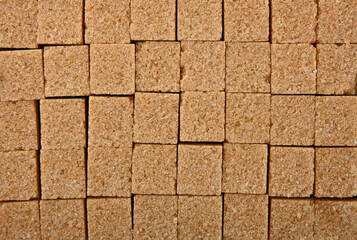 Obraz premium Background texture pattern of brown sugar cubes