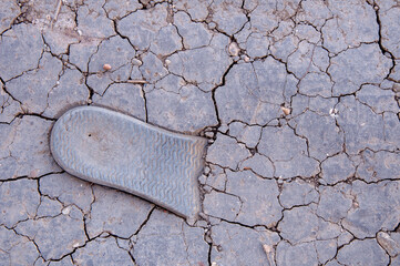 drought makes the ground barren, texture of cracked earth close-up