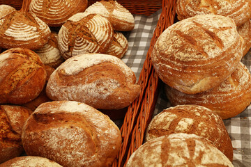 Assorted fresh bread loaves on retail display