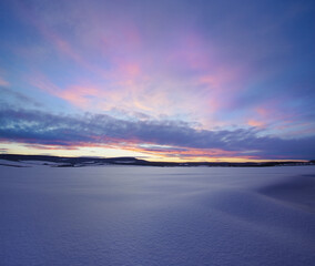 Fototapeta premium A serene winter landscape after sunset.