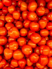 lots of ripe red tomato cooking as a background