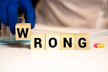 Wrong - word from wooden blocks with letters.