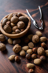 winter mix nuts image with hand cracker