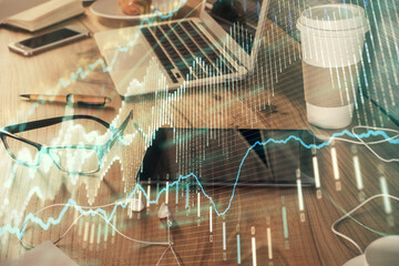Double exposure of forex chart drawing and cell phone background. Concept of financial trading